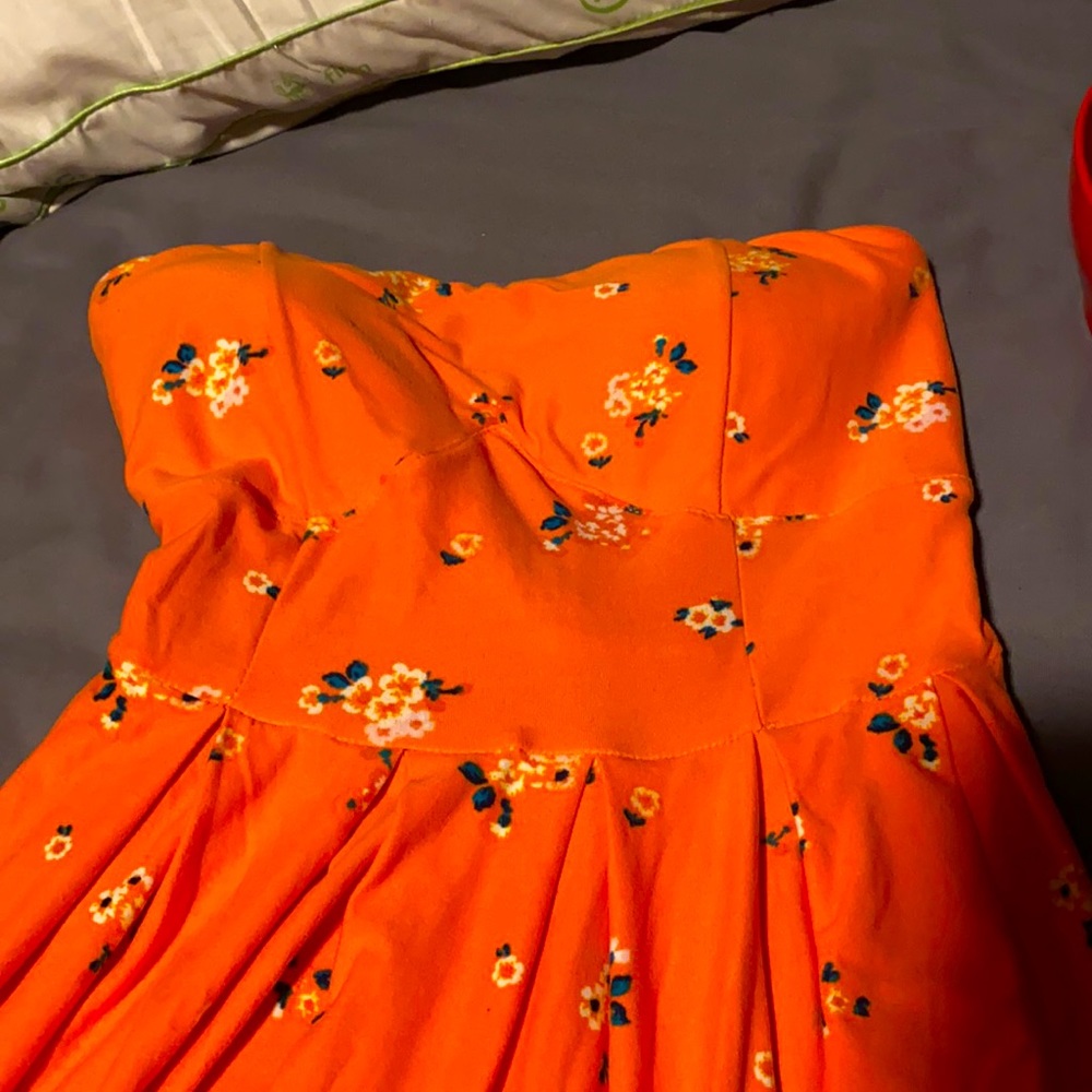 Very soft peachy-orange strapless floral dress
